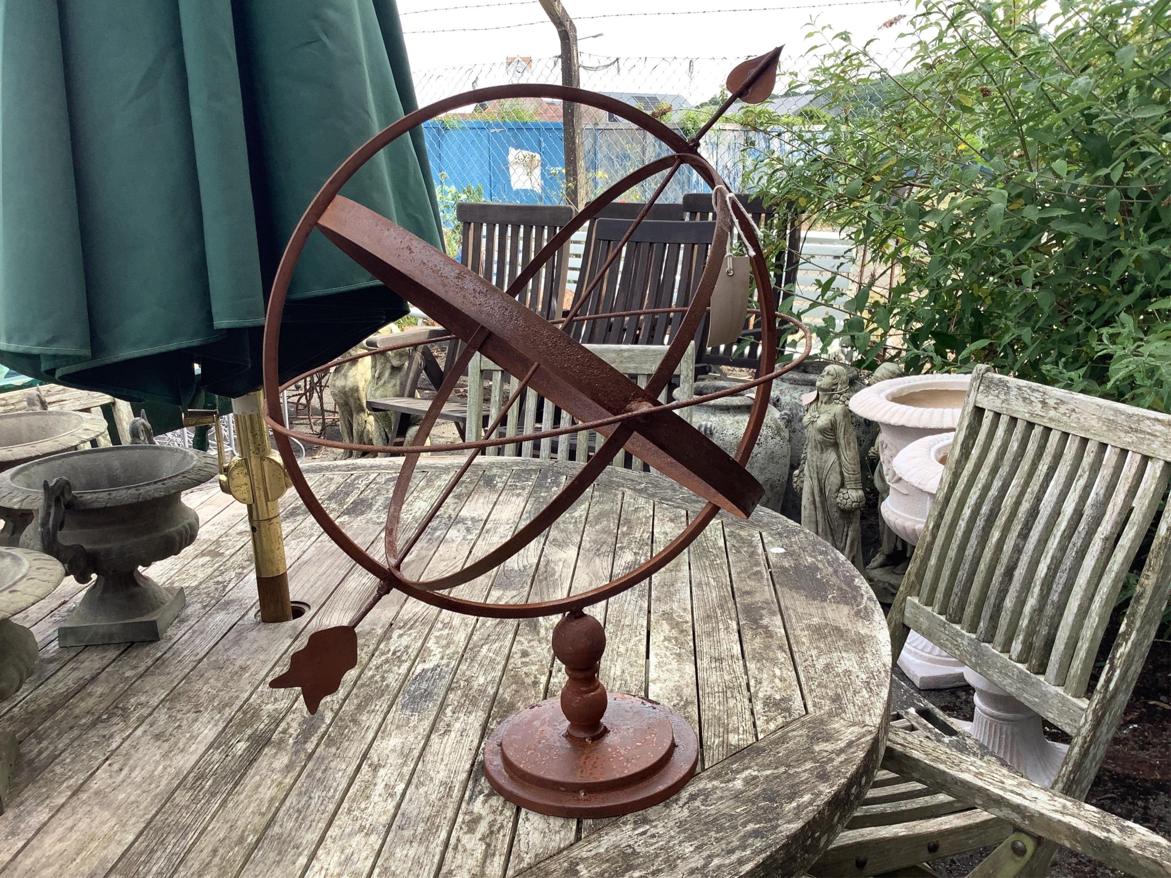 A metal armillary sphere, height 62cm. Condition - fair